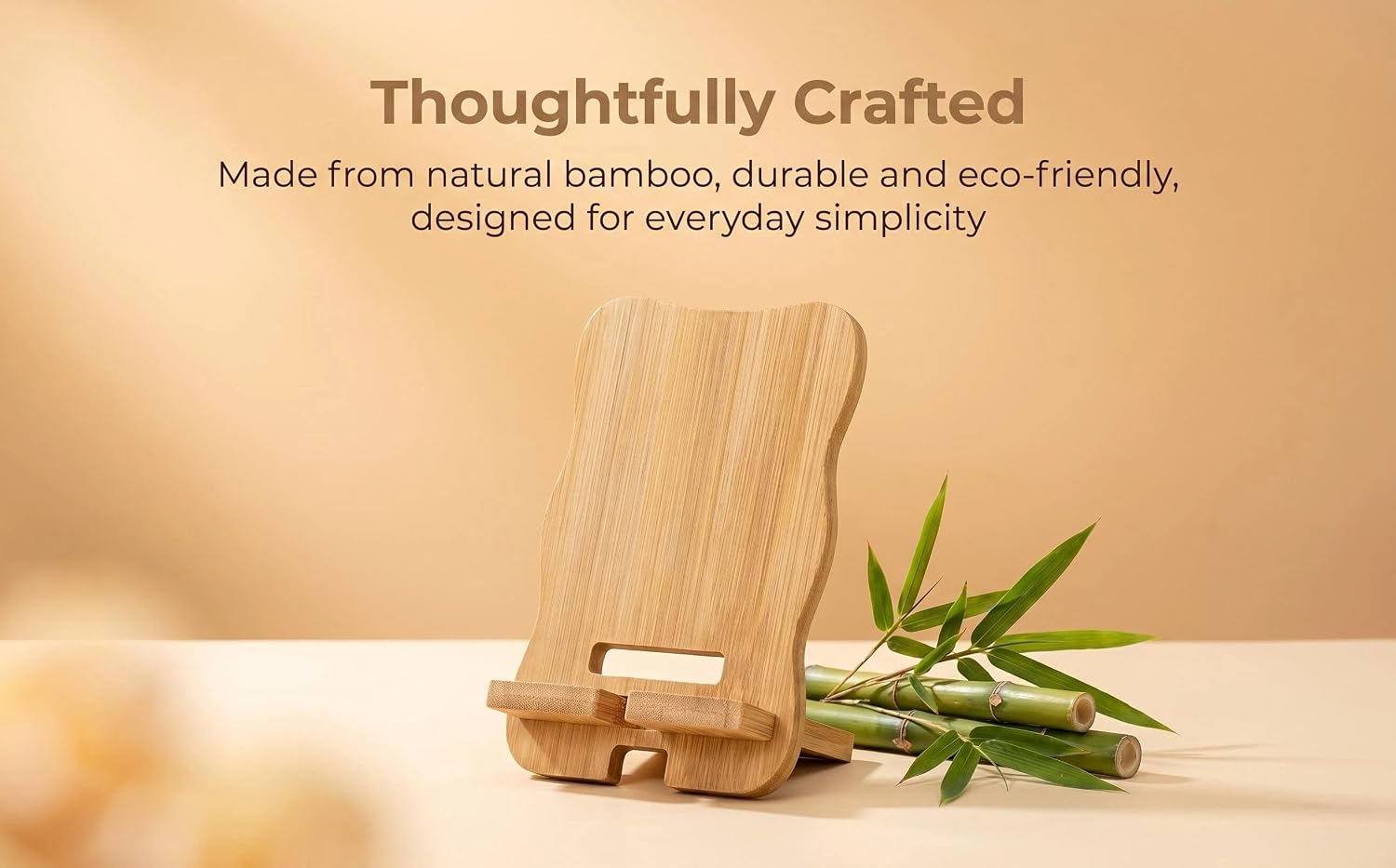 Text reads 'Thoughtfully Crafted' and 'Made from natural bamboo, durable and eco-friendly, designed for everyday simplicity.' Natural bamboo phone stand with green bamboo leaves and neutral wood-tone aesthetic.