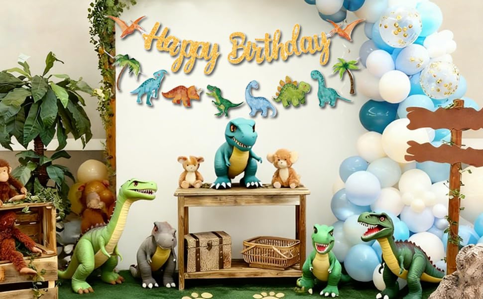 Text reads 'Happy Birthday'. Decorative scene with blue and white balloons, woodland-themed decorations including animal figures and tree elements.