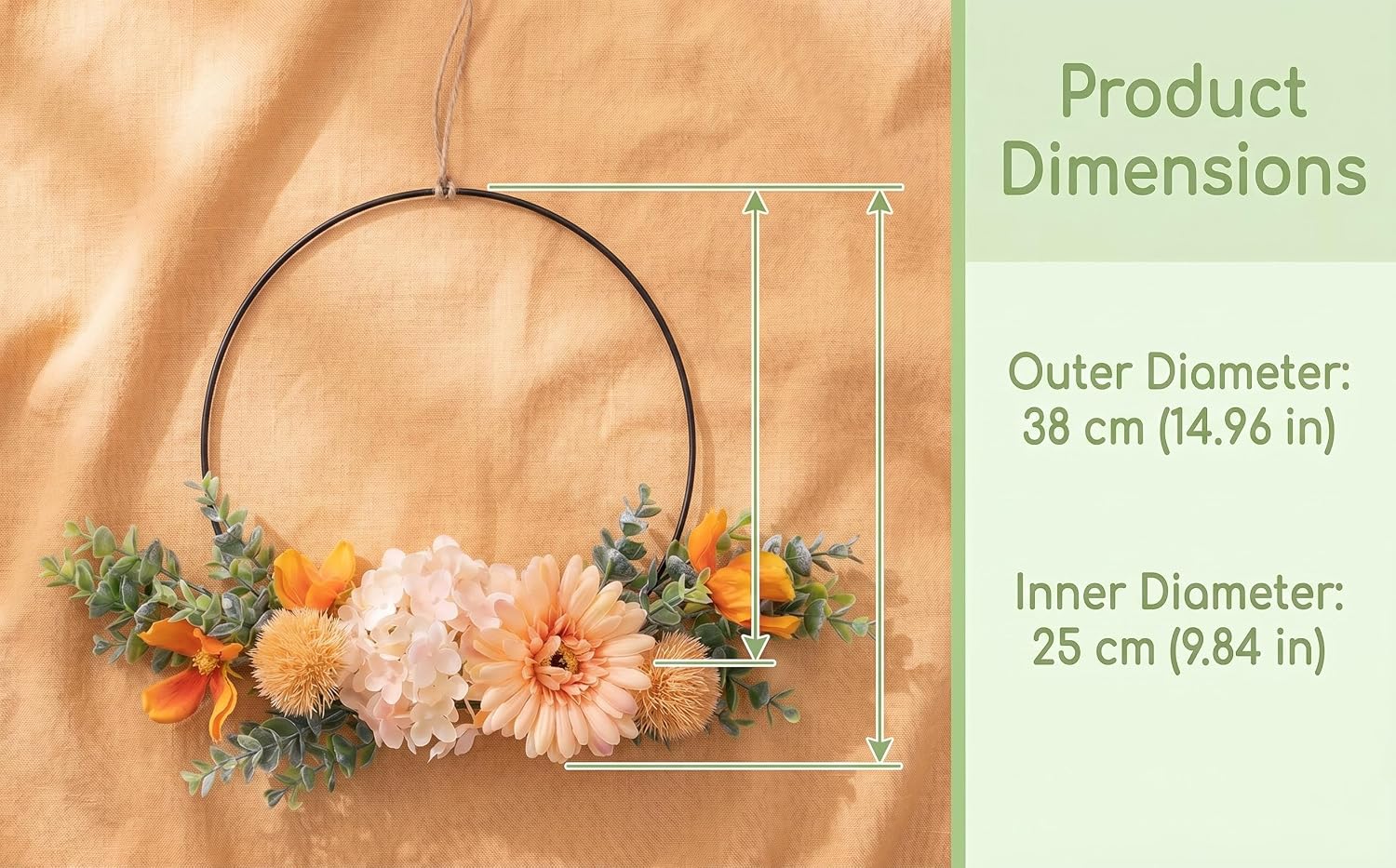 Text reads 'Product Dimensions: Outer Diameter: 38 cm (14.96 in) Inner Diameter: 28 cm (11.04 in)'. Circular wreath with dried flowers in cream, peach, and green tones displayed on woven natural background.