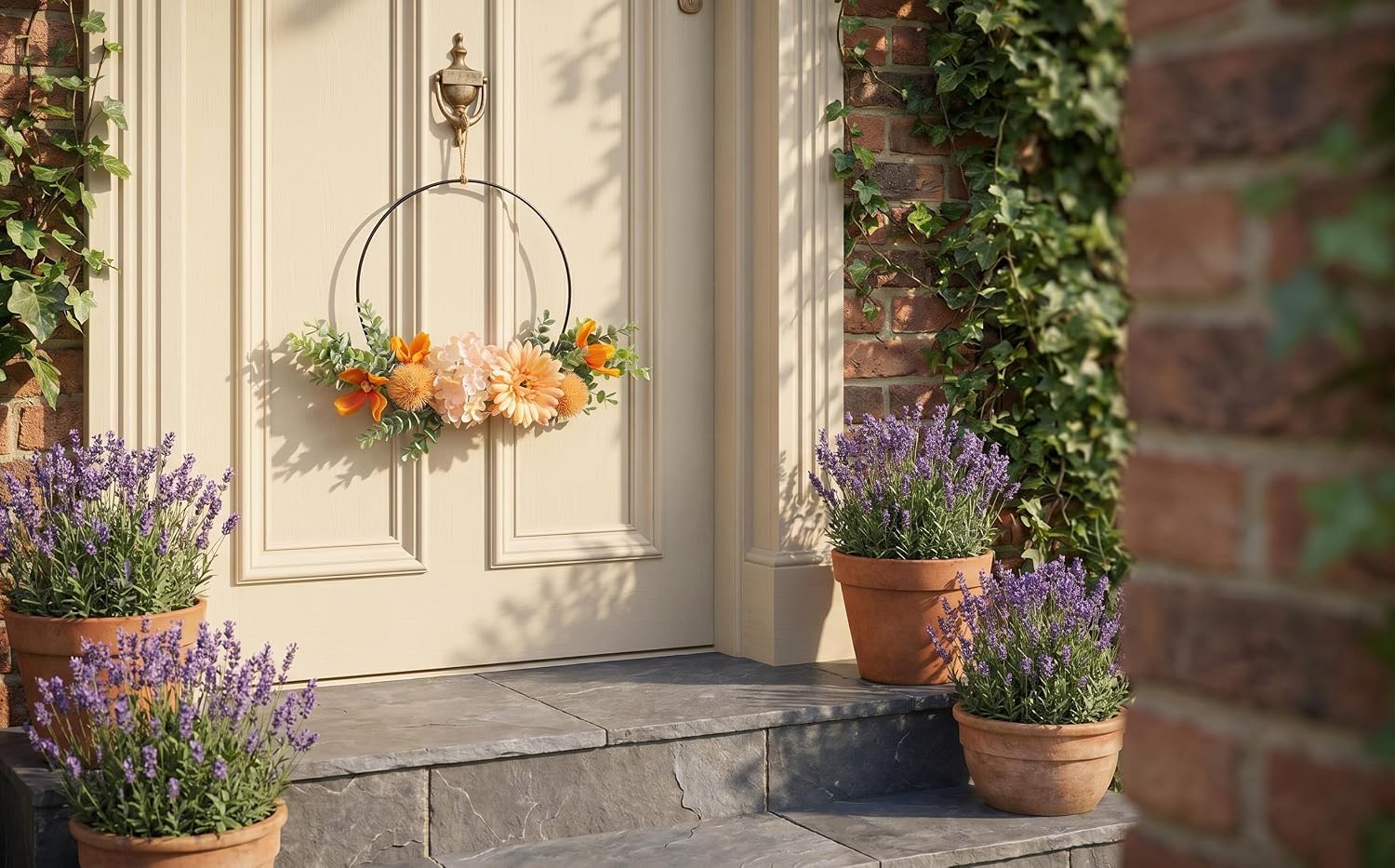 Outdoor decorative scene featuring hanging glass globe planters with yellow-orange flowers suspended from ceiling, purple flowering plants in terracotta pot on ground, architectural entrance setting.